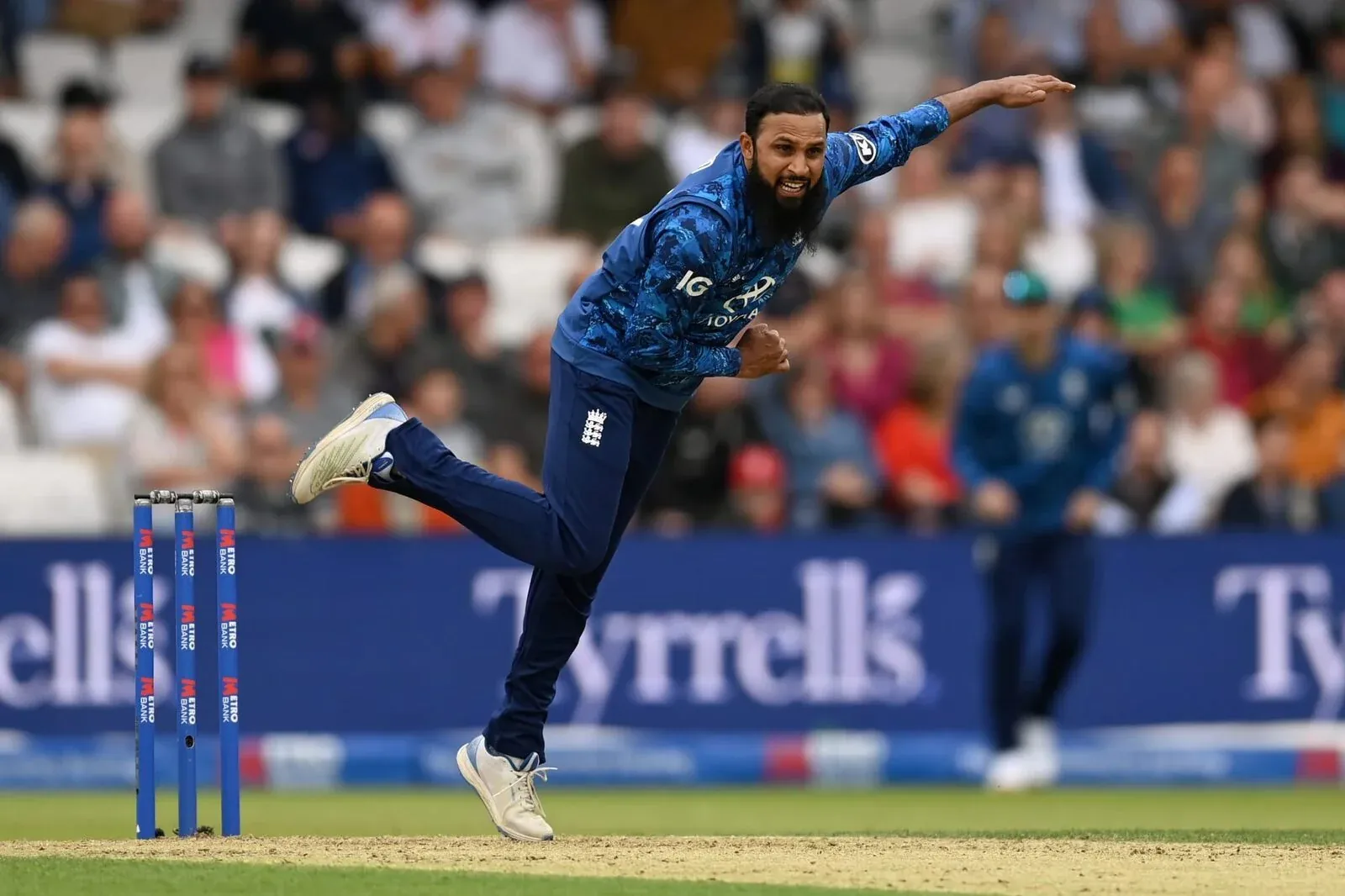 Adil Rashid bowling for England